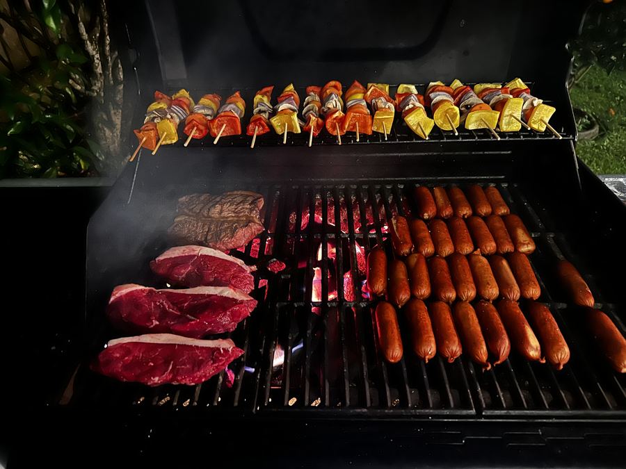 Steaks and sausages on grill