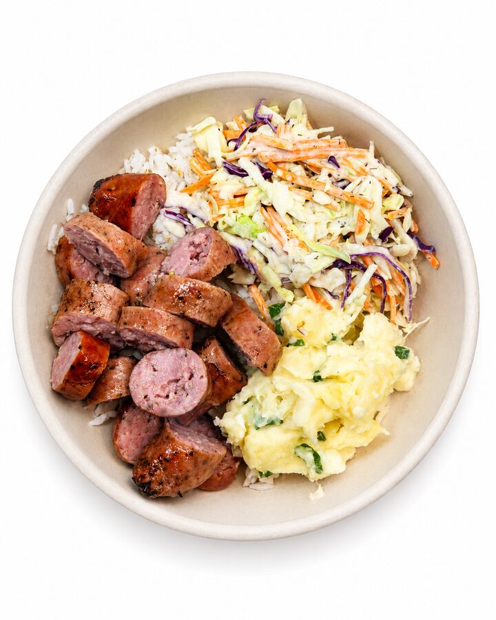 Brazilian sausage rice bowl with slaw and eggs