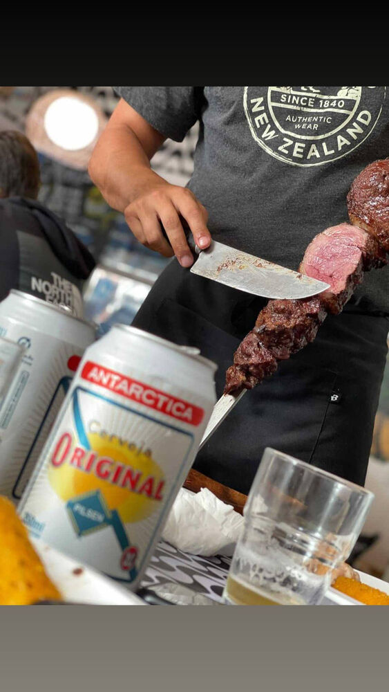 Carving picanha from the skewer