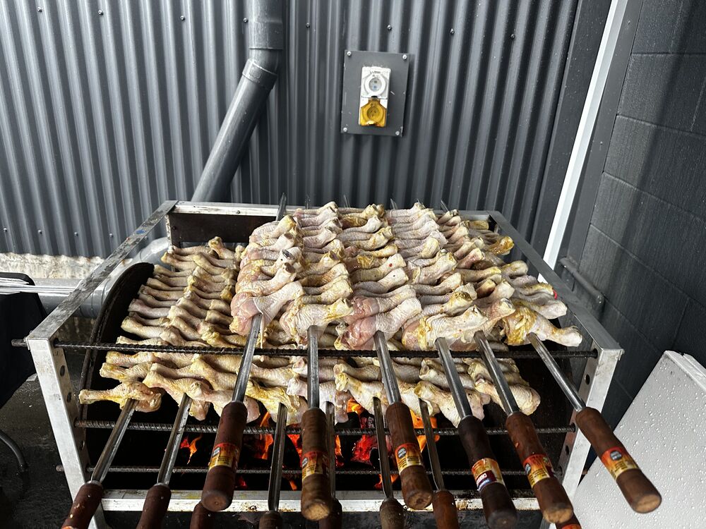 Chicken skewers prepared over live fire