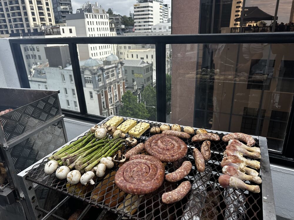 Rooftop grill with sausages and vegetables